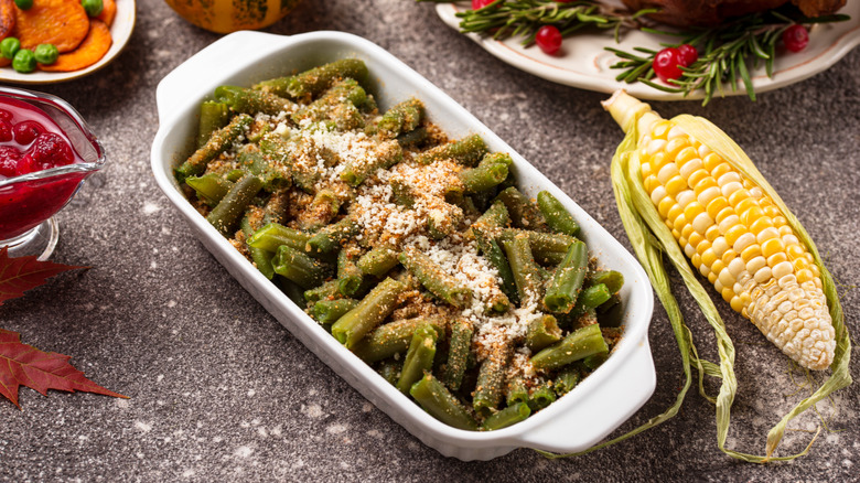 Baking green beans casserole with cheese and bread crumbs. Thanksgiving Day food