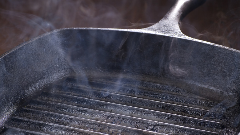 burger patties in a cast-iron skillet