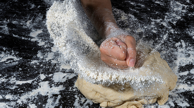 Fist hitting dough