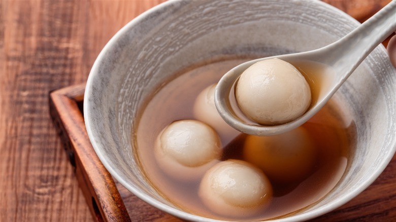 dumplings in bowl and sauce