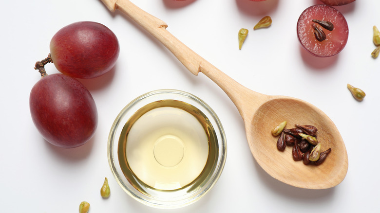 red grapes with grape seeds and oil