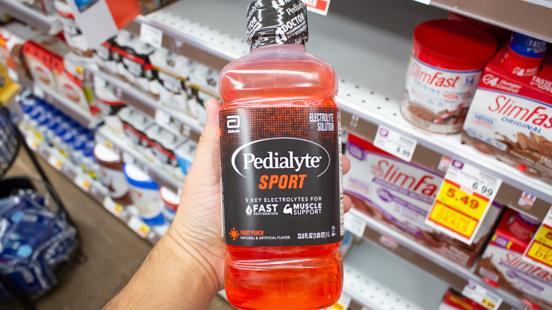 Pedialyte Sport held in hand