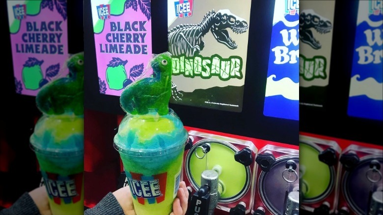 Dinosaur flavored ICEE in front of ICEE machine