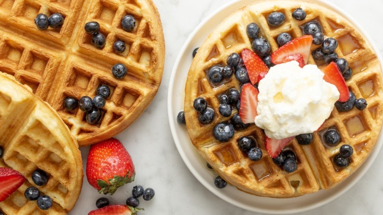 belgian waffles with whipped cream and berries