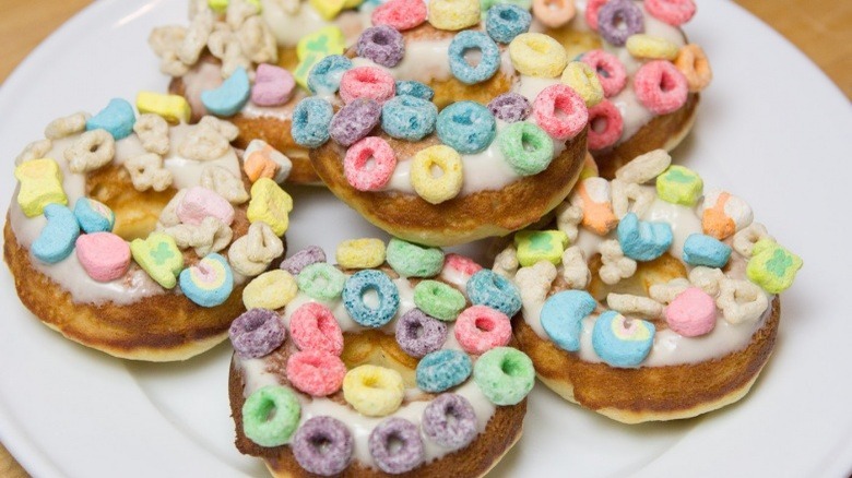 plate of breakfast cereal doughnuts with froot loops and lucky charms