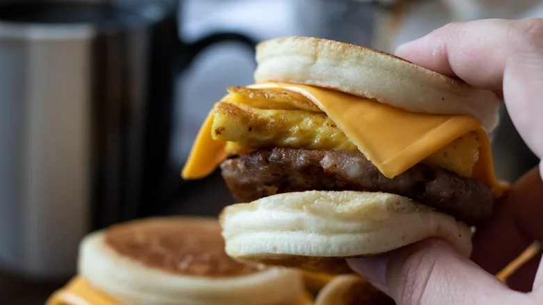 hand holding copycat mcdonald's sausage egg and cheese mcgriddle