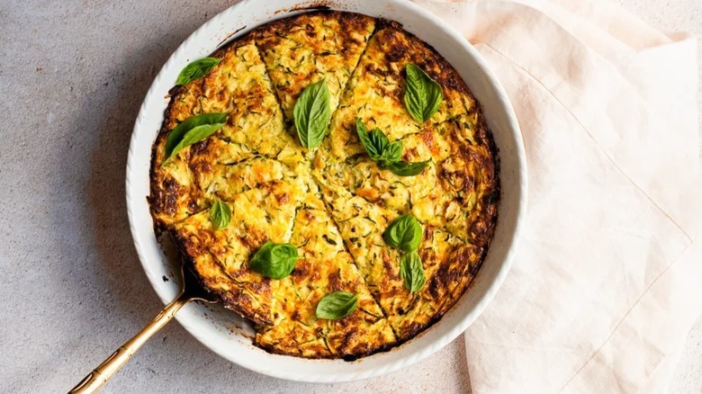 dish of crustless zucchini quiche with serving fork