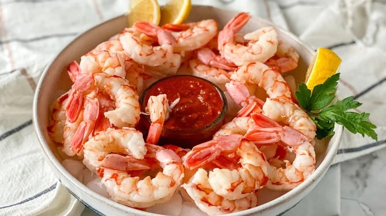 bowl of shrimp cocktail with cocktail sauce