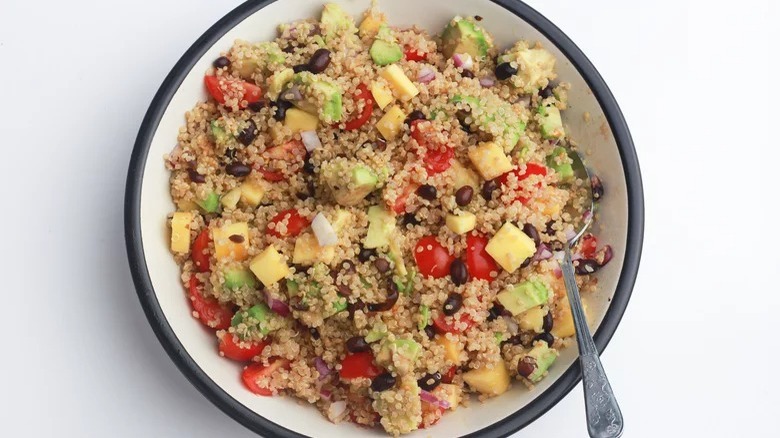 bowl of mango quinoa salad with spoon