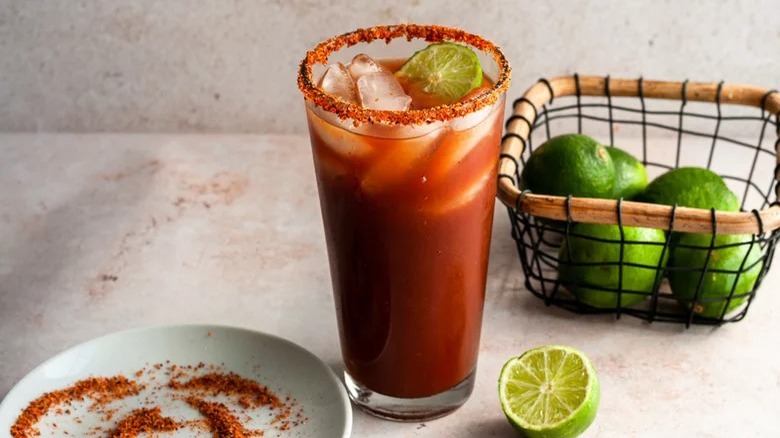 michelada with basket of limes