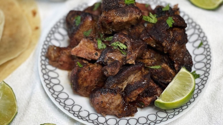 pork on plate with lime