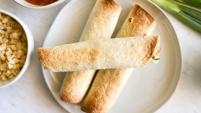 taquitos on white plate