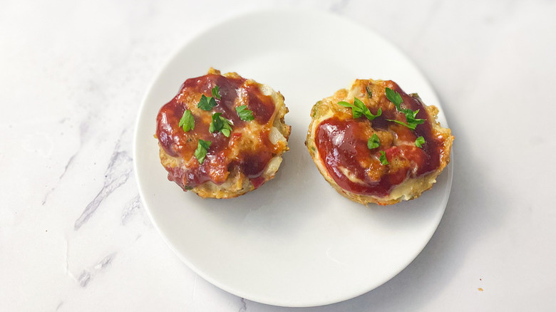 miniature meatloaves on white plate