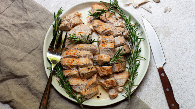 sliced turkey tenderloin on plate