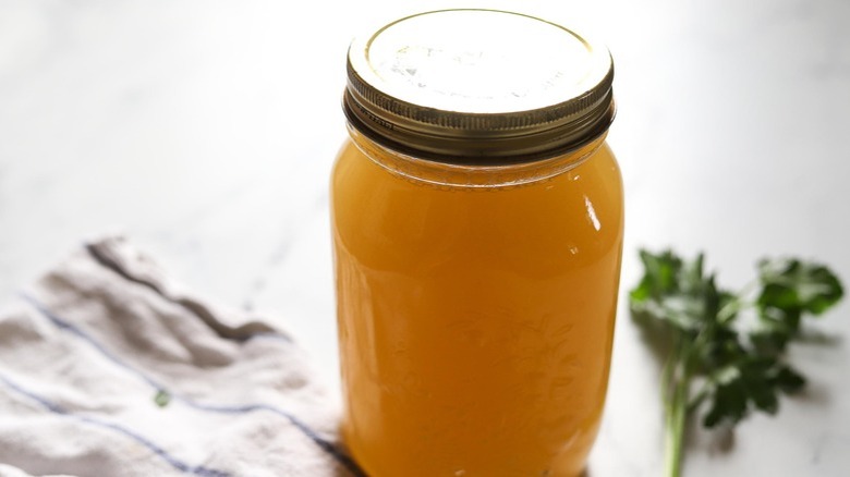 lidded jar of soup stock