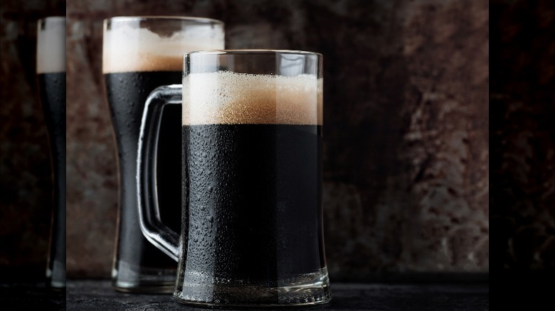 mugs of dark beer