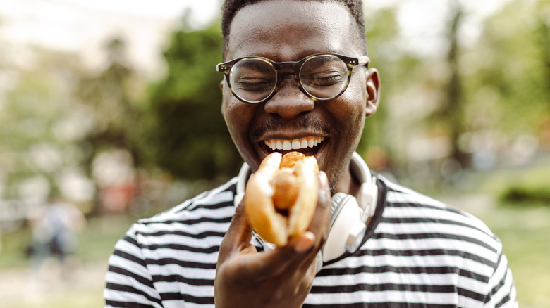 Man eating a hot dog