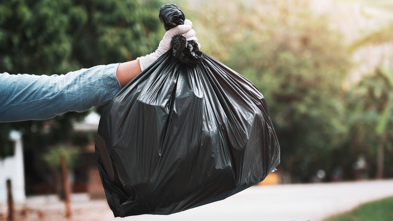 Person throwing away trash