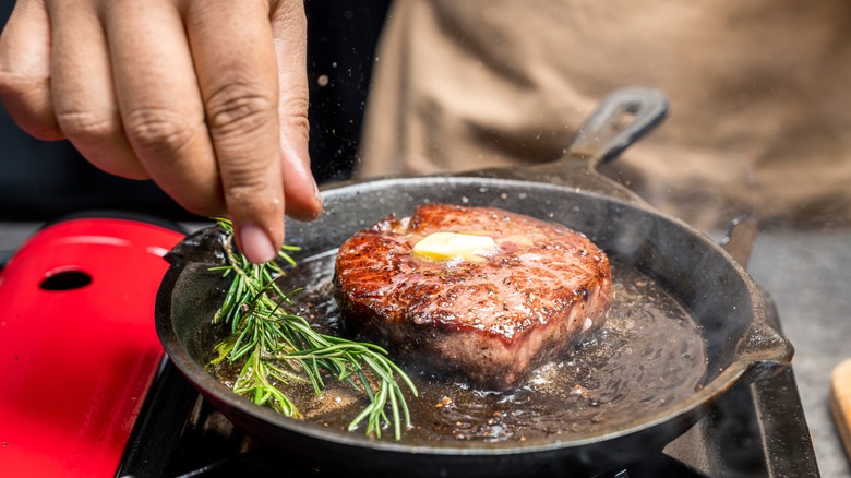 beef tenderloin cooking with butter