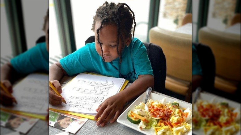 Kid doing activity sheet at Ruby Tuesday