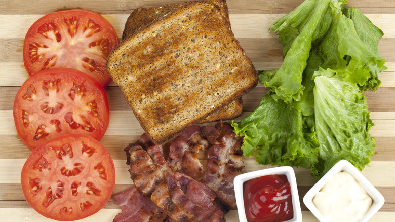 BLT ingredients with sliced beefsteak tomatoes