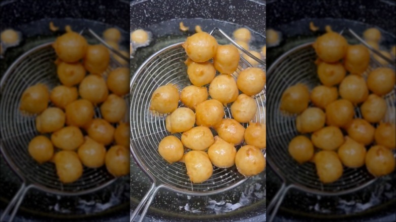 spooning homemade doughnut holes