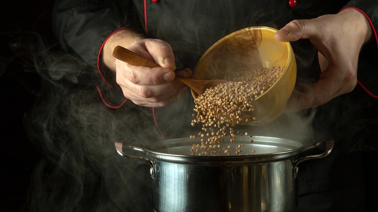 person cooking buckwheat