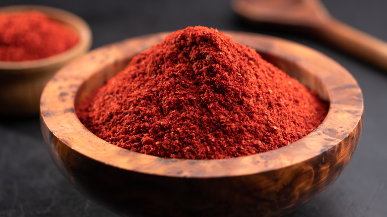 Ground paprika in wooden bowl 