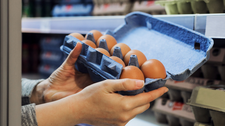 Woman looking at eggs