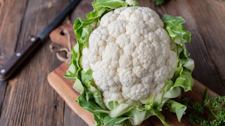 whole cauliflower on cutting board