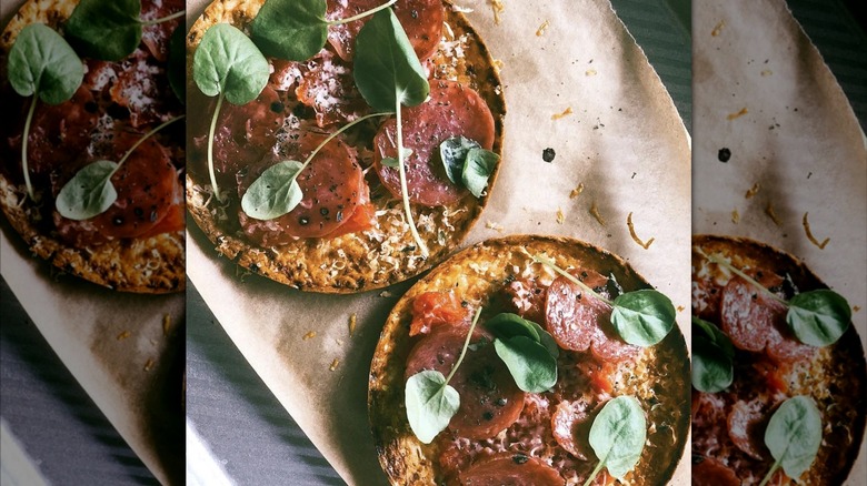 Open-faced sandwich with pepperoni and herbs