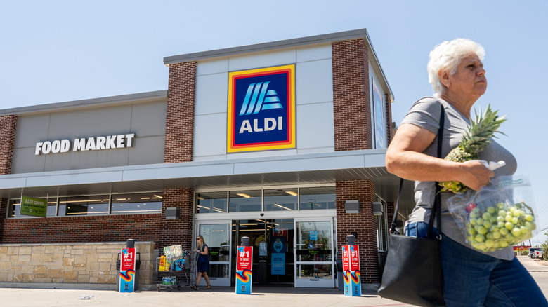 Shoppers leaving an Aldi store