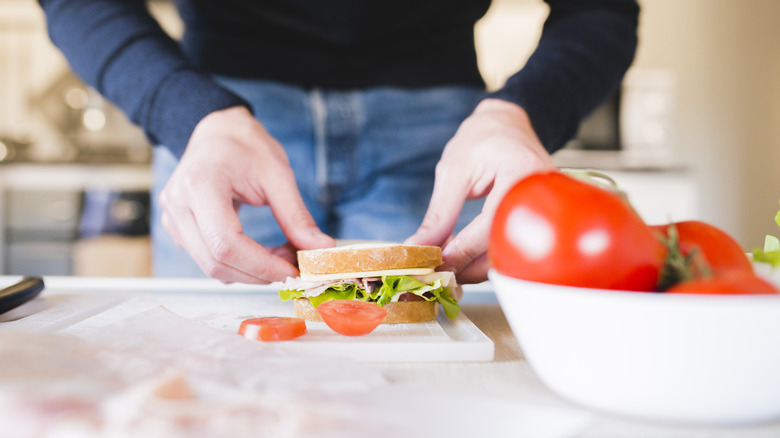 woman making a sandwich