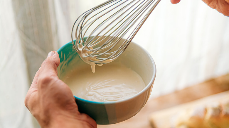 man making homemade mayo