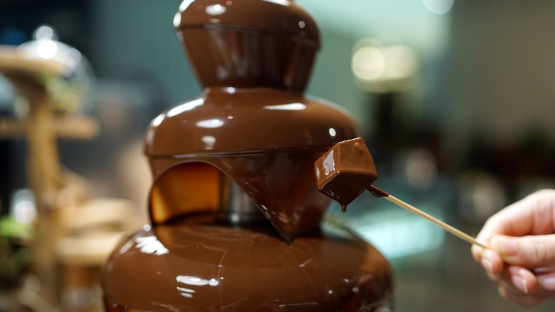 Dipped marshmallow, chocolate fondue fountain