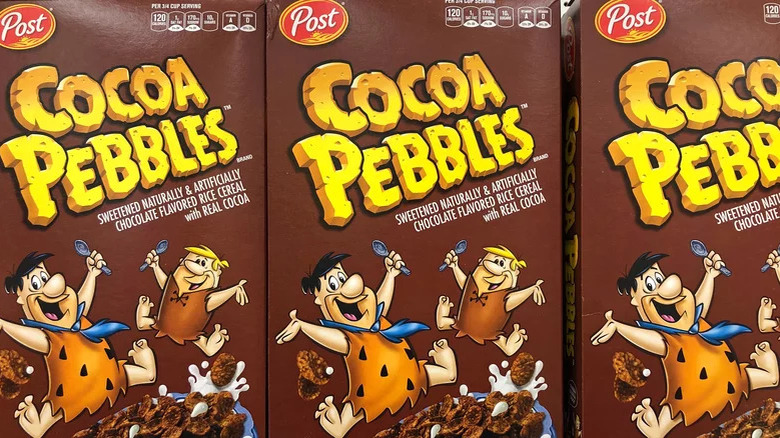 three boxes of cocoa pebbles