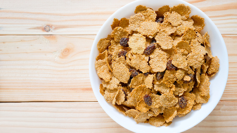 filled bowl of raisin bran cereal 