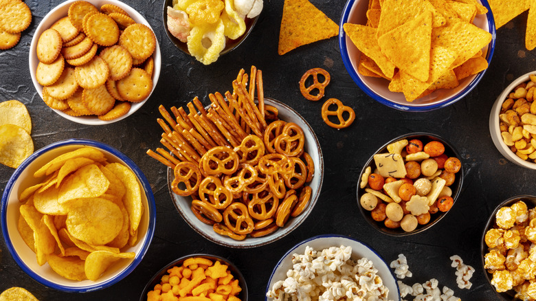 Assorted snacks on black table