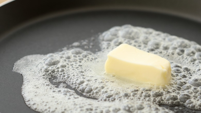 butter melting in frying pan