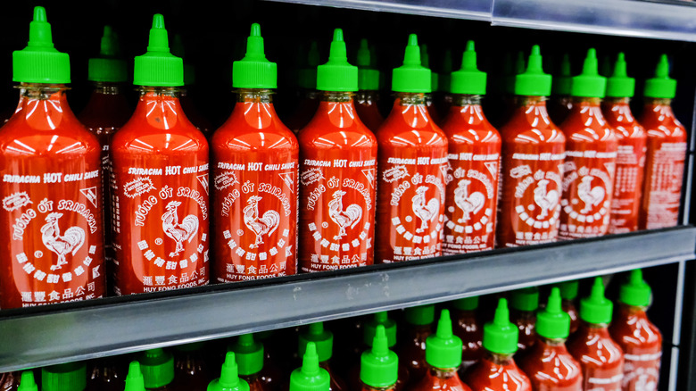 store shelf of bottles of Sriracha sauce
