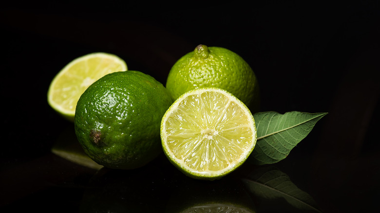 limes on black background