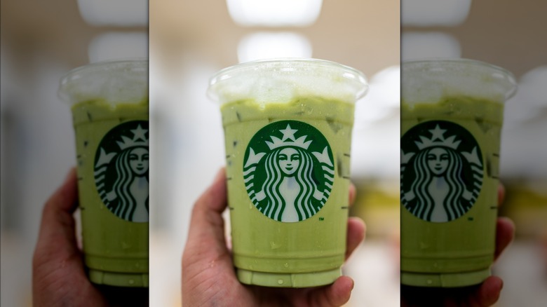 Starbucks iced matcha cup being held