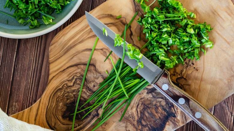 knife with chopped chives