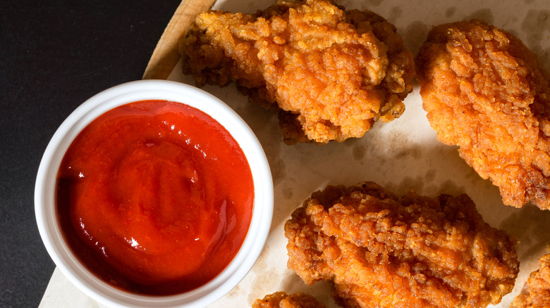 pieces of fried chicken with ketchup