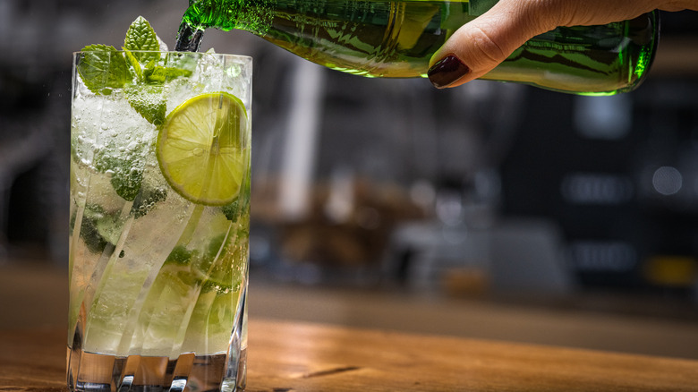 Person pouring sparkling water