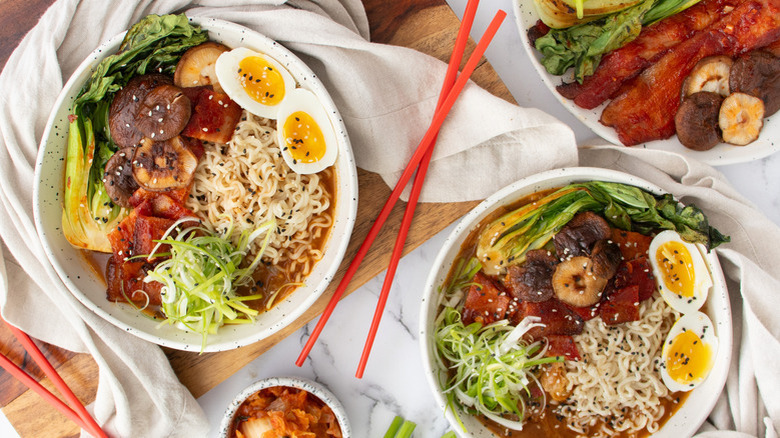 two bowls of pork belly kimchi ramen