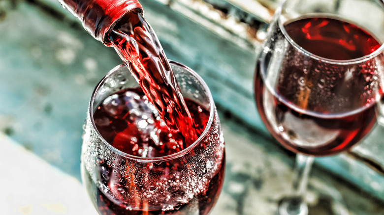 red wine pouring in glass