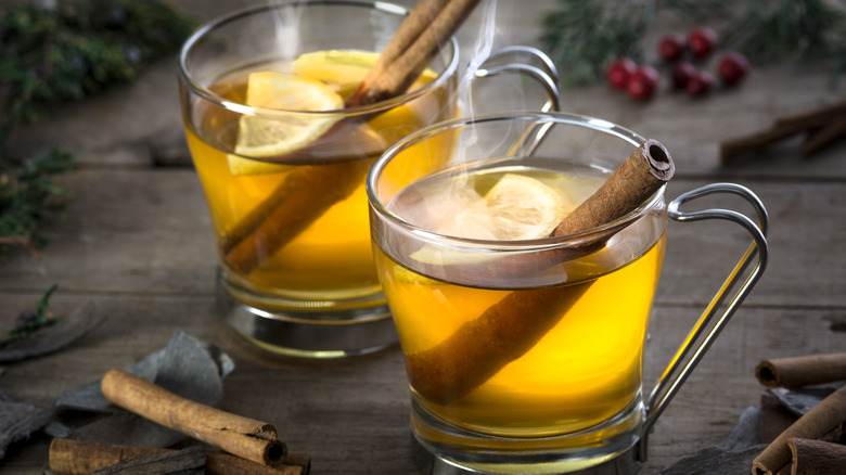 Pair of hot toddy cocktails on wood