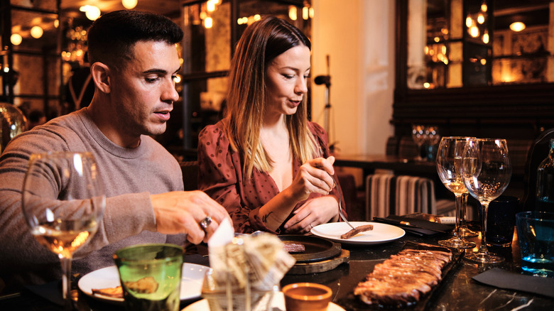 people eating at steakhouse