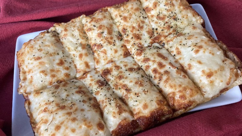 cheesy bread sticks on plate